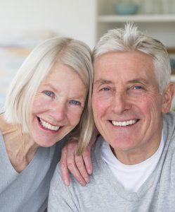 Elder couple with dental implants