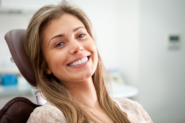 Brunette woman at Troy Bartels, DDS in Jonesboro for an biannual dental checkup to improve her oral health