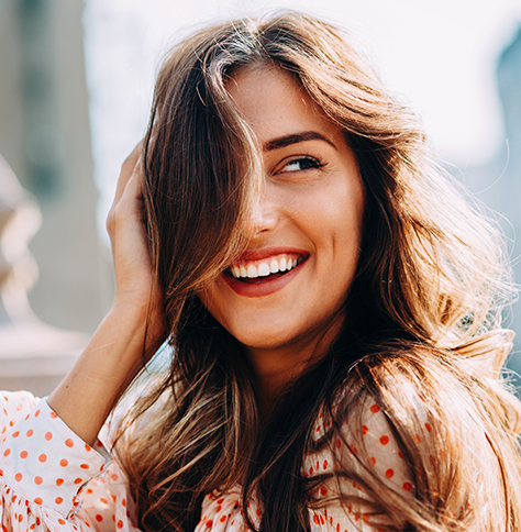 woman smiling over her shoulder